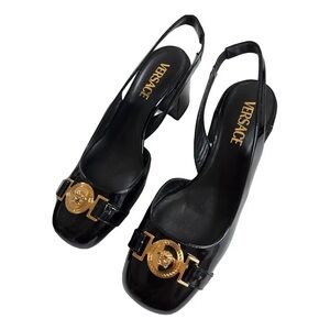 Versace Medusa Head Slingback Pumps in black patent leather.